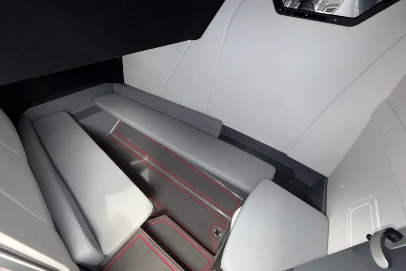 Slide: The Image of Interior of 2025 Sunsation 32 CCX boat, featuring sleek gray seating and modern design. - 34