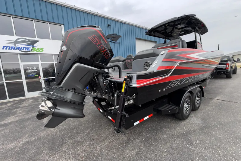 Slide: The Image of 2025 Sunsation 32 CCX boat with powerful outboard engine, parked outside Marine365 showroom. - 5