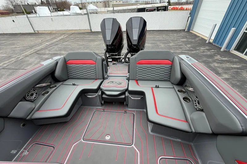 Slide: The Image of 2025 Sunsation 32 CCX boat interior with gray and red seating, dual engines visible. - 9