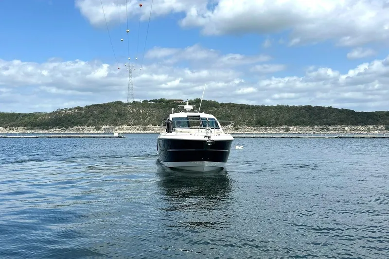 Slide: The Image of 2017 Monterey 360 Sport Coupe on calm water with scenic background. - 10
