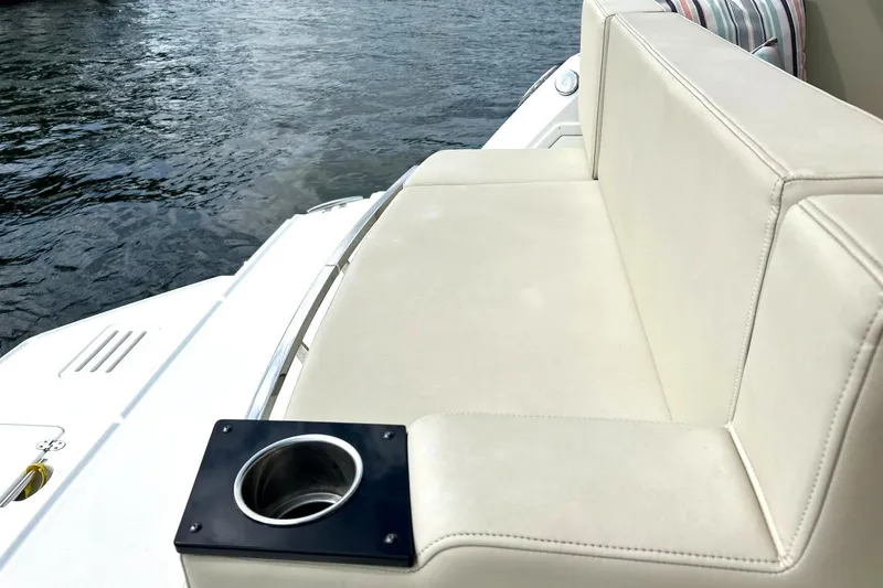 Slide: The Image of Luxurious seating on a 2017 Monterey 360 Sport Coupe yacht with cup holder, near water. - 20