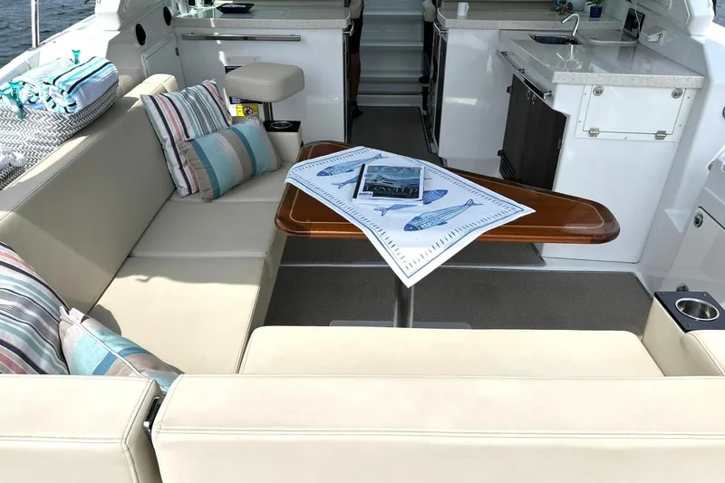 Slide: The Image of Luxurious interior of a 2017 Monterey 360 Sport Coupe yacht with elegant seating and table. - 22
