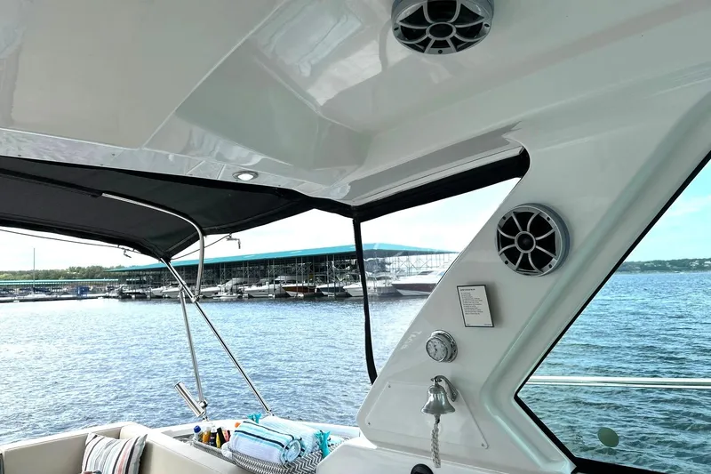 Slide: The Image of Interior view of a 2017 Monterey 360 Sport Coupe yacht with marina backdrop. - 26