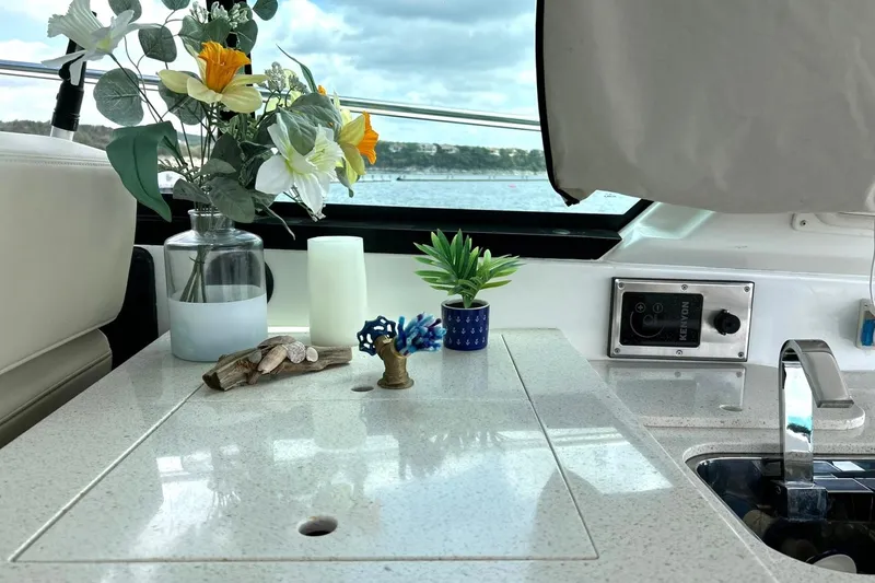 Slide: The Image of Interior of 2017 Monterey 360 Sport Coupe with flowers and decor on countertop. - 31