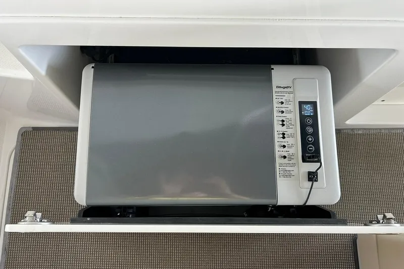 Slide: The Image of Built-in refrigerator in 2017 Monterey 360 Sport Coupe boat interior. - 33