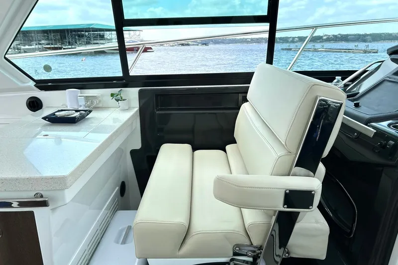 Slide: The Image of Interior of 2017 Monterey 360 Sport Coupe with luxurious seating and scenic water view. - 41