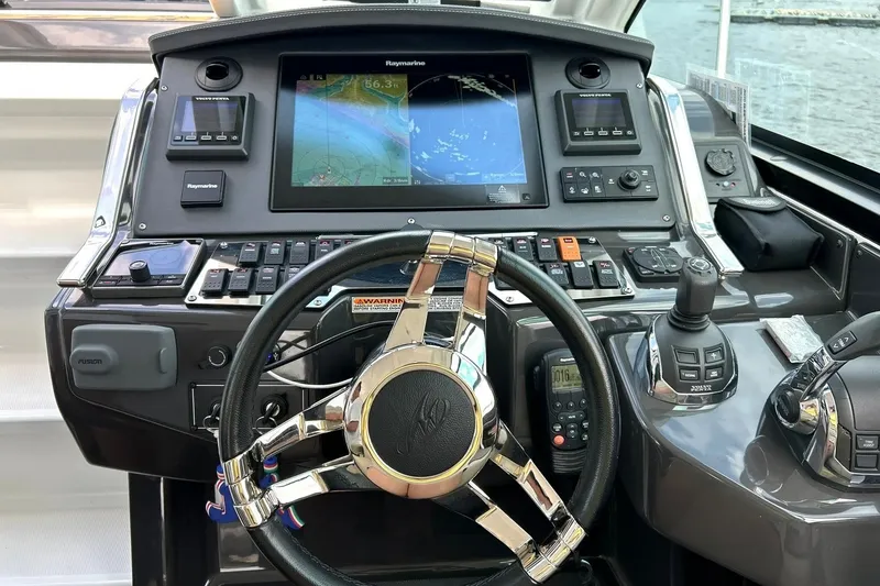 Slide: The Image of Control panel of a 2017 Monterey 360 Sport Coupe with navigation display and steering wheel. - 46