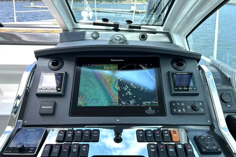 Slide: The Image of Control panel of a 2017 Monterey 360 Sport Coupe with navigation and monitoring systems. - 47