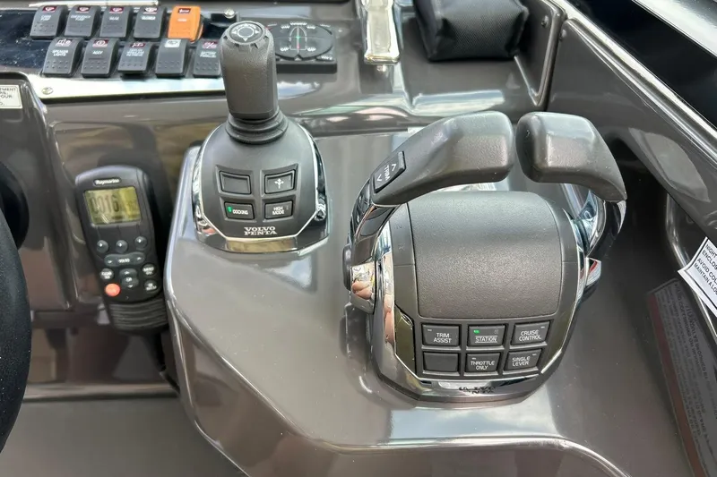 Slide: The Image of Control panel of a 2017 Monterey 360 Sport Coupe with joystick and throttle controls. - 48