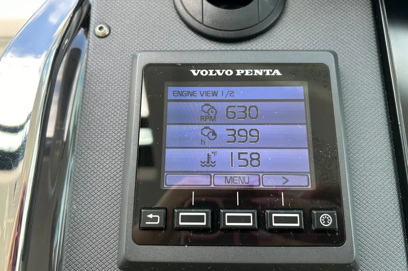 Slide: The Image of Volvo Penta engine display showing RPM, hours, and temperature on a 2017 Monterey 360 Sport Coupe. - 51