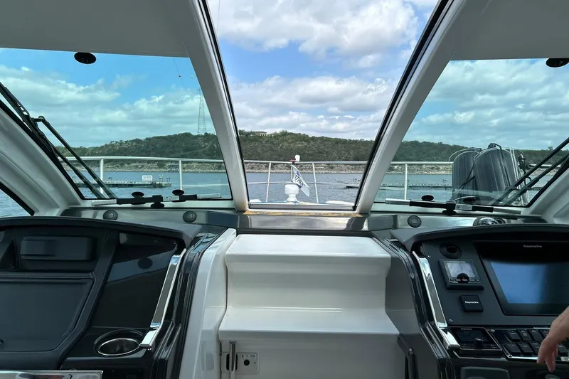 Slide: The Image of 2017 Monterey 360 Sport Coupe cockpit with scenic water view. - 52