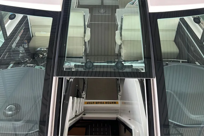 Slide: The Image of 2017 Monterey 360 Sport Coupe interior view with seating and helm controls. - 56