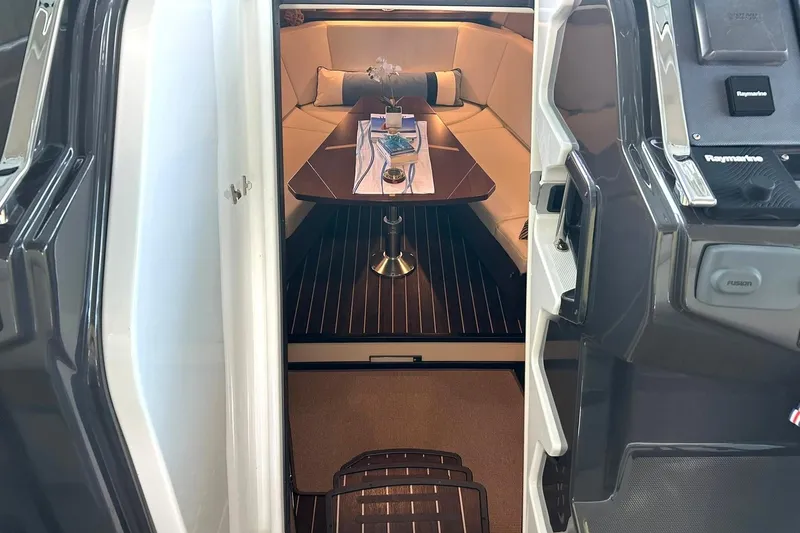 Slide: The Image of Luxurious interior of a 2017 Monterey 360 Sport Coupe yacht with elegant seating and table. - 57