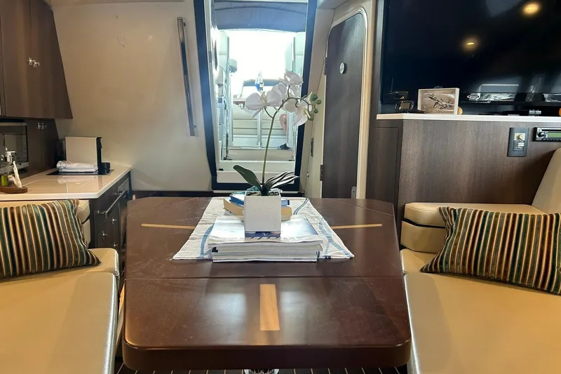 Slide: The Image of Interior of a 2017 Monterey 360 Sport Coupe yacht with elegant dining area and modern decor. - 67