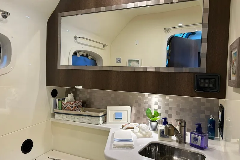 Slide: The Image of Luxurious bathroom in a 2017 Monterey 360 Sport Coupe yacht with modern fixtures. - 74