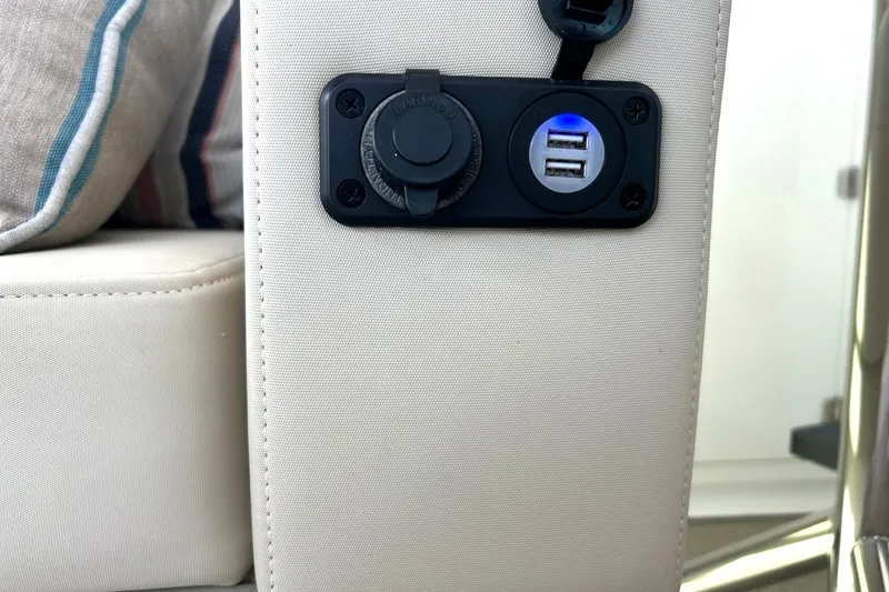 Slide: The Image of USB charging ports on a 2017 Monterey 360 Sport Coupe boat interior. - 83