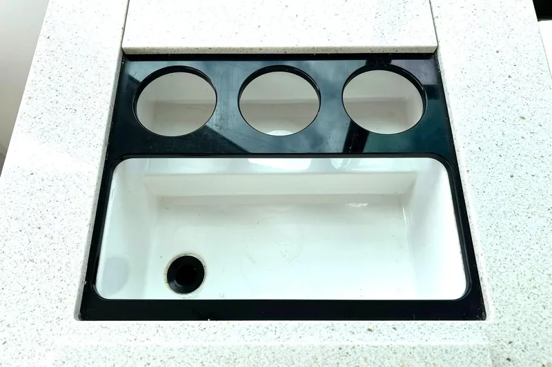 Slide: The Image of White sink with three cup holders on a 2017 Monterey 360 Sport Coupe. - 84