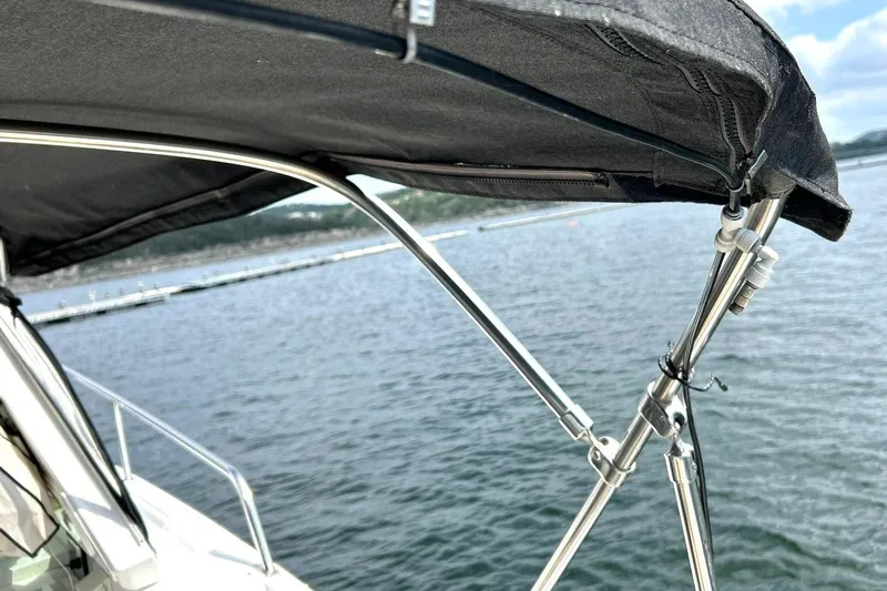 Slide: The Image of 2017 Monterey 360 Sport Coupe boat canopy over calm waters. - 86