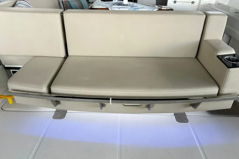 Slide: The Image of Luxurious seating on a 2017 Monterey 360 Sport Coupe yacht with cup holder. - 88