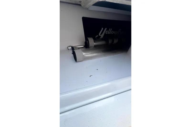 Slide: The Image of 2017 Yellowfin 21 Hybrid boat interior detail with visible storage compartment. - 10