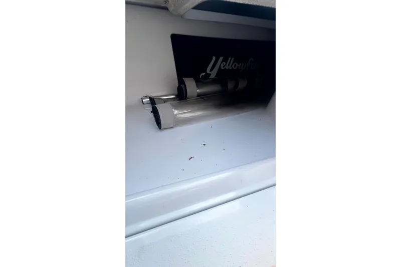 Slide: The Image of 2017 Yellowfin 21 Hybrid boat interior detail with storage compartment. - 11