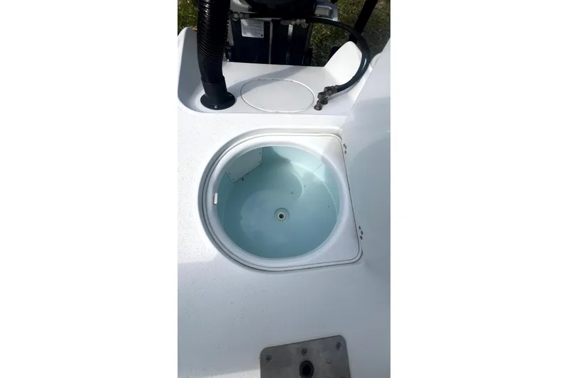 Slide: The Image of Livewell on 2017 Yellowfin 21 Hybrid boat, featuring clean white interior. - 15