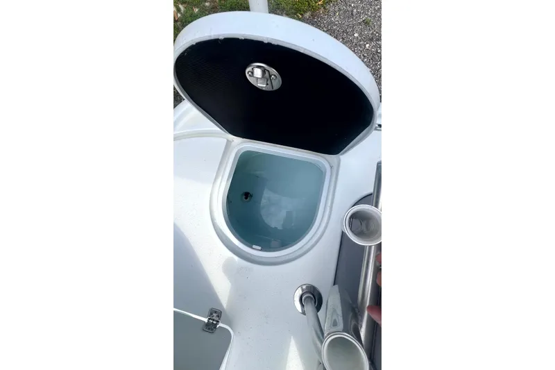 Slide: The Image of Open storage compartment on 2017 Yellowfin 21 Hybrid boat, showcasing interior details. - 17