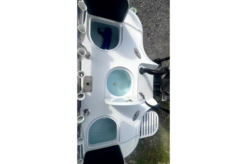 Slide: The Image of 2017 Yellowfin 21 Hybrid boat deck with rod holders and storage compartments. - 18