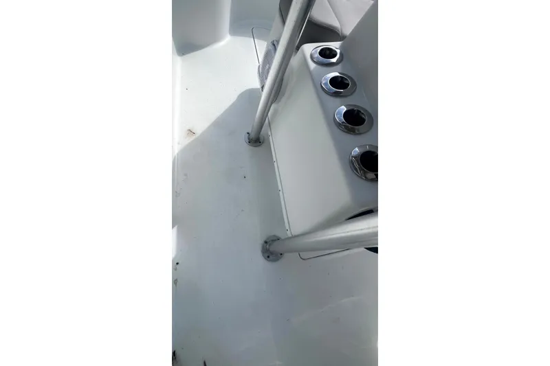 Slide: The Image of 2017 Yellowfin 21 Hybrid boat interior with rod holders and metal supports. - 21