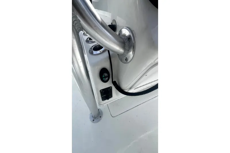 Slide: The Image of 2017 Yellowfin 21 Hybrid boat console with stainless steel fittings and controls. - 22