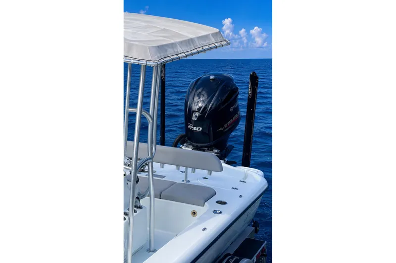 Slide: The Image of 2017 Yellowfin 21 Hybrid boat interior with seating and motor. - 25
