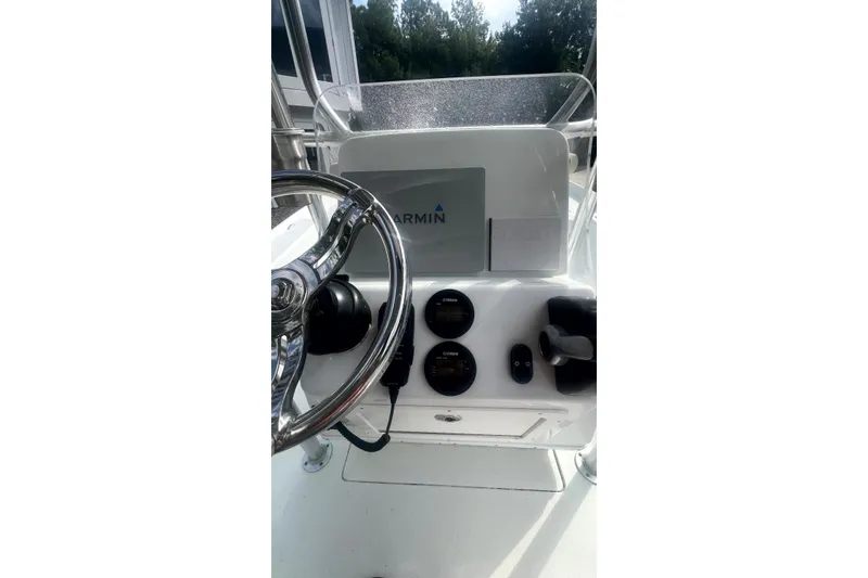 Slide: The Image of 2017 Yellowfin 21 Hybrid boat console with Garmin navigation system and steering wheel. - 5