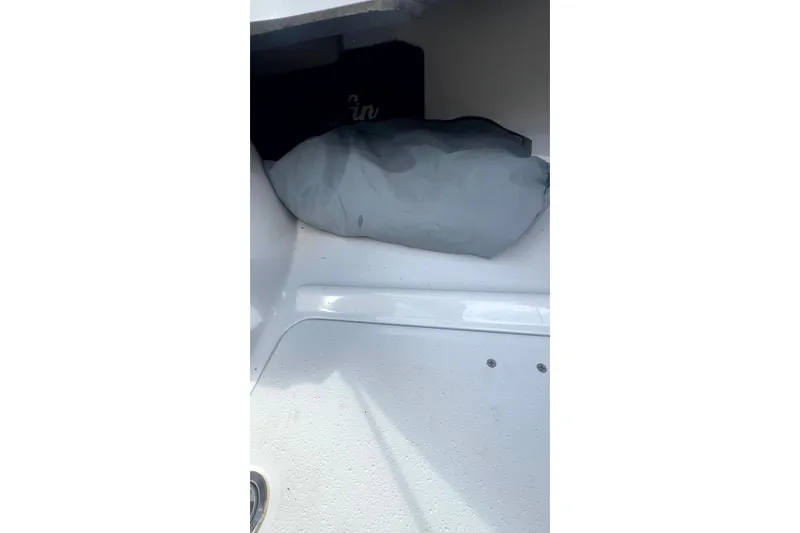 Slide: The Image of Interior view of a 2017 Yellowfin 21 Hybrid boat storage compartment. - 9