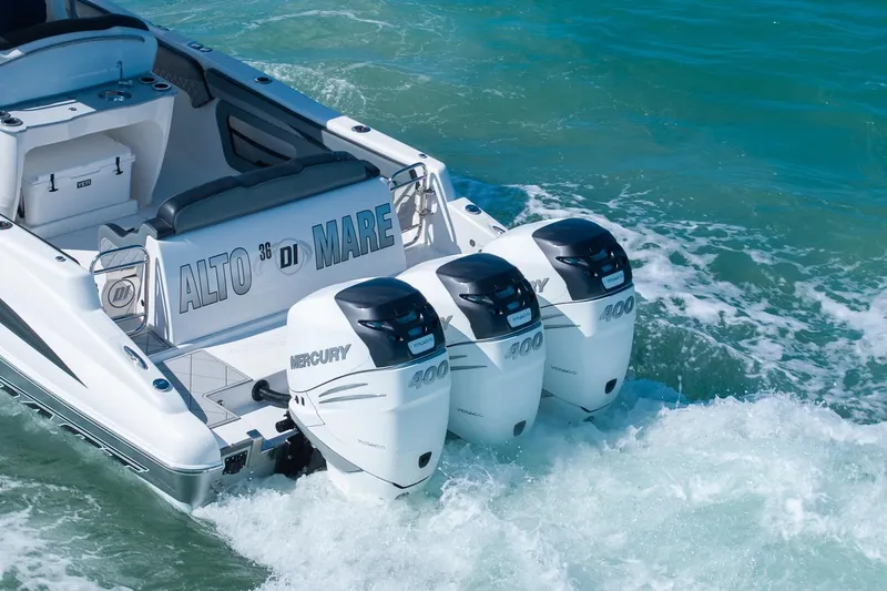 Slide: The Image of 2019 Deep Impact 369 Sport boat with triple Mercury 400 engines on the ocean. - 11