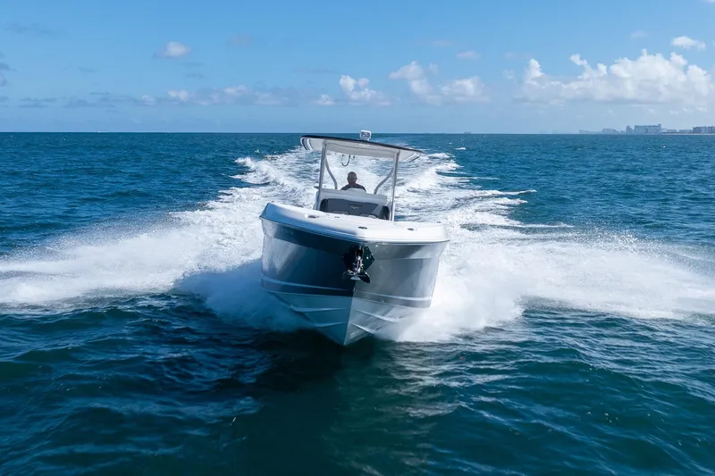 Slide: The Image of 2019 Deep Impact 369 Sport boat cruising on open ocean under clear blue sky. - 15