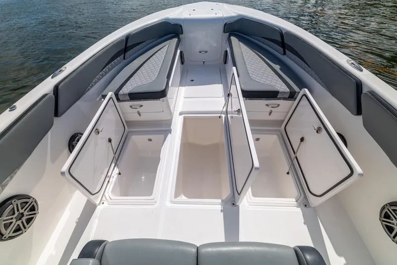 Slide: The Image of 2019 Deep Impact 369 Sport boat interior with open storage compartments and cushioned seating. - 28