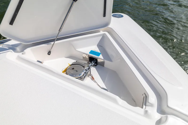 Slide: The Image of Open anchor compartment on 2019 Deep Impact 369 Sport boat, showing anchor mechanism. - 37