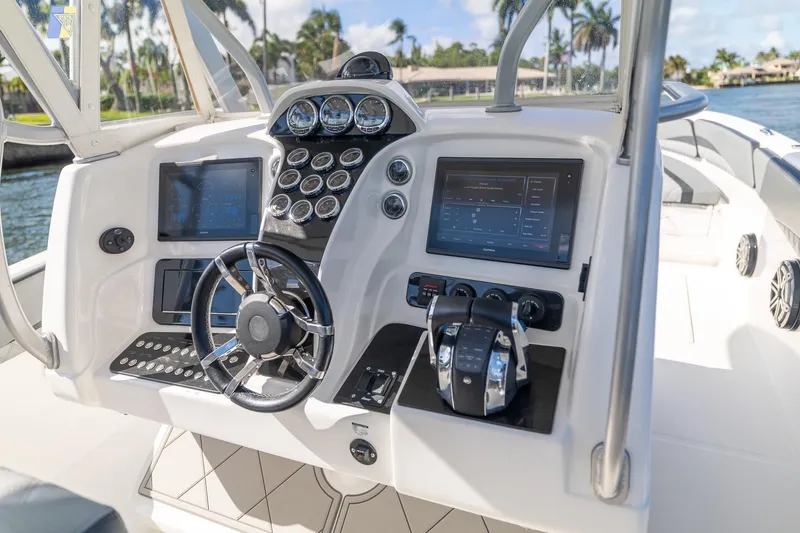 Slide: The Image of Cockpit of 2019 Deep Impact 369 Sport boat with advanced navigation controls and displays. - 38