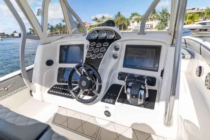Slide: The Image of 2019 Deep Impact 369 Sport boat dashboard with advanced controls and navigation screens. - 39