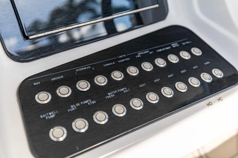 Slide: The Image of Control panel of a 2019 Deep Impact 369 Sport boat with labeled buttons. - 40