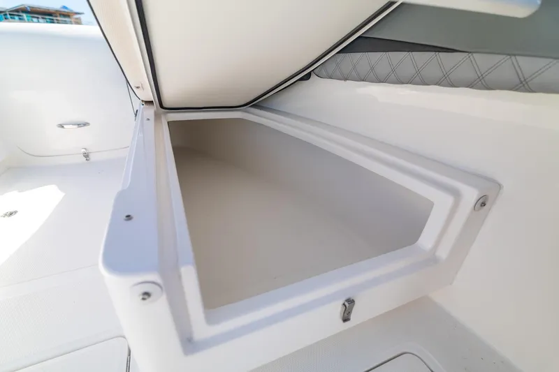 Slide: The Image of Open storage compartment on a 2019 Deep Impact 369 Sport boat. - 46