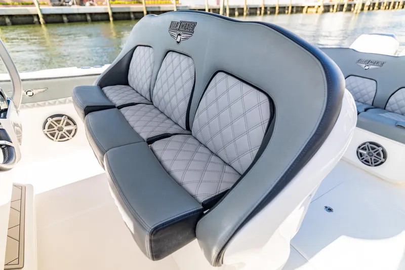 Slide: The Image of Luxurious seating on a 2019 Deep Impact 369 Sport boat, featuring diamond-stitched upholstery. - 49