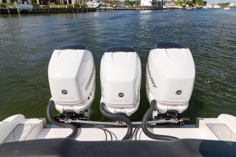 Slide: The Image of 2019 Deep Impact 369 Sport boat with triple Mercury outboard engines on water. - 57