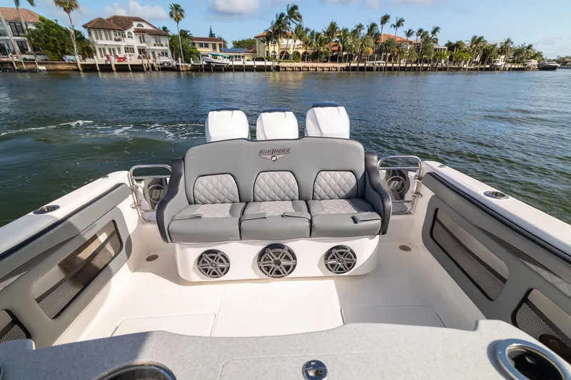 Slide: The Image of Luxury seating on 2019 Deep Impact 369 Sport boat, with waterfront view. - 59