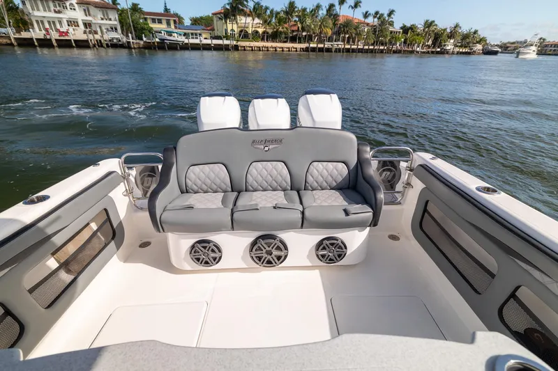 Slide: The Image of 2019 Deep Impact 369 Sport boat interior with luxurious seating and waterfront view. - 60