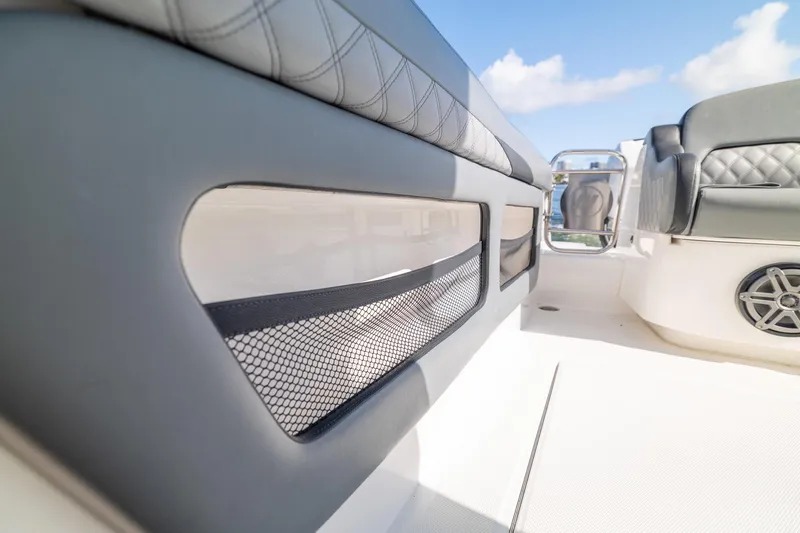 Slide: The Image of Interior view of 2019 Deep Impact 369 Sport boat, featuring sleek seating and storage netting. - 65