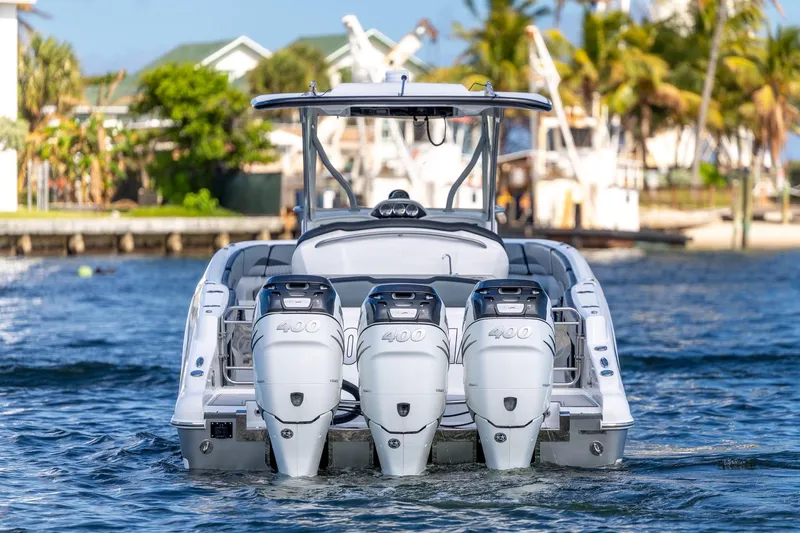 Slide: The Image of 2019 Deep Impact 369 Sport boat with triple 400 horsepower engines on the water. - 7