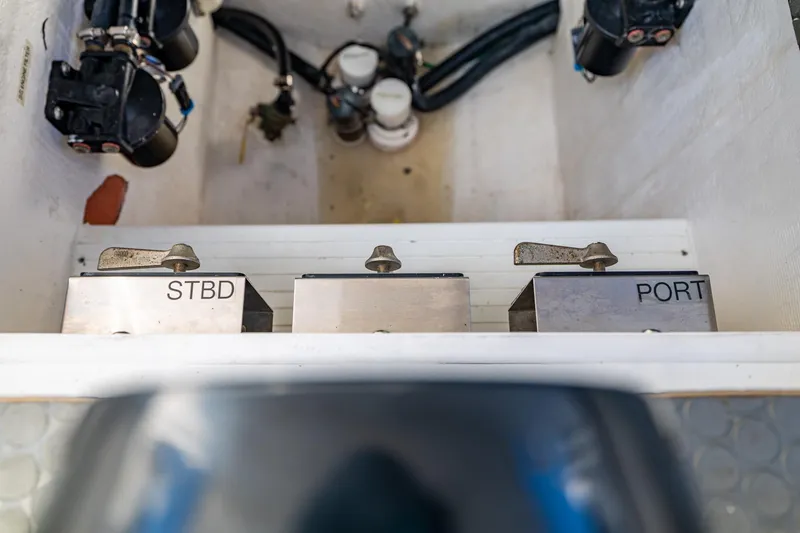 Slide: The Image of 2019 Deep Impact 369 Sport boat controls labeled "STBD" and "PORT" in engine compartment. - 75