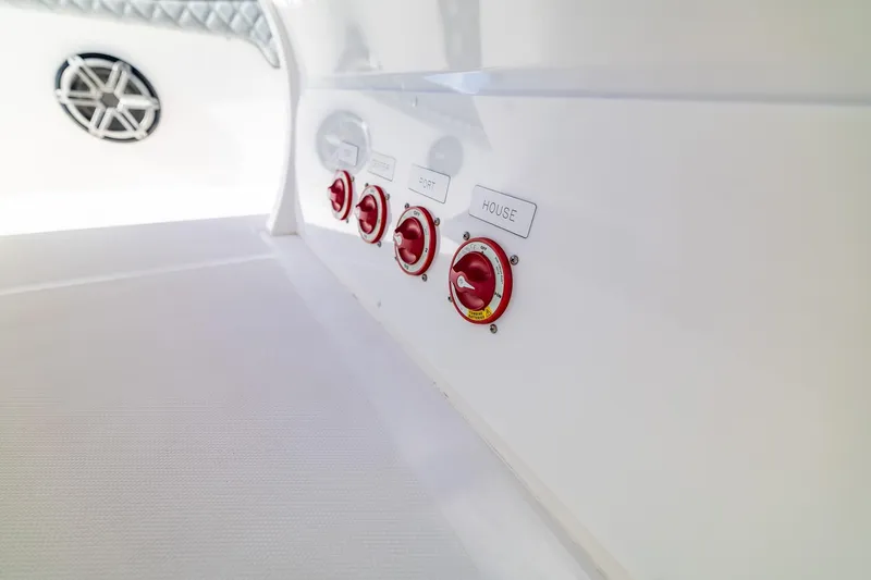 Slide: The Image of Control panel on 2019 Deep Impact 369 Sport boat with labeled switches. - 78