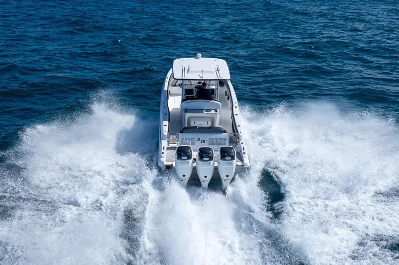 Slide: The Image of 2019 Deep Impact 369 Sport boat speeding on open ocean waters. - 79